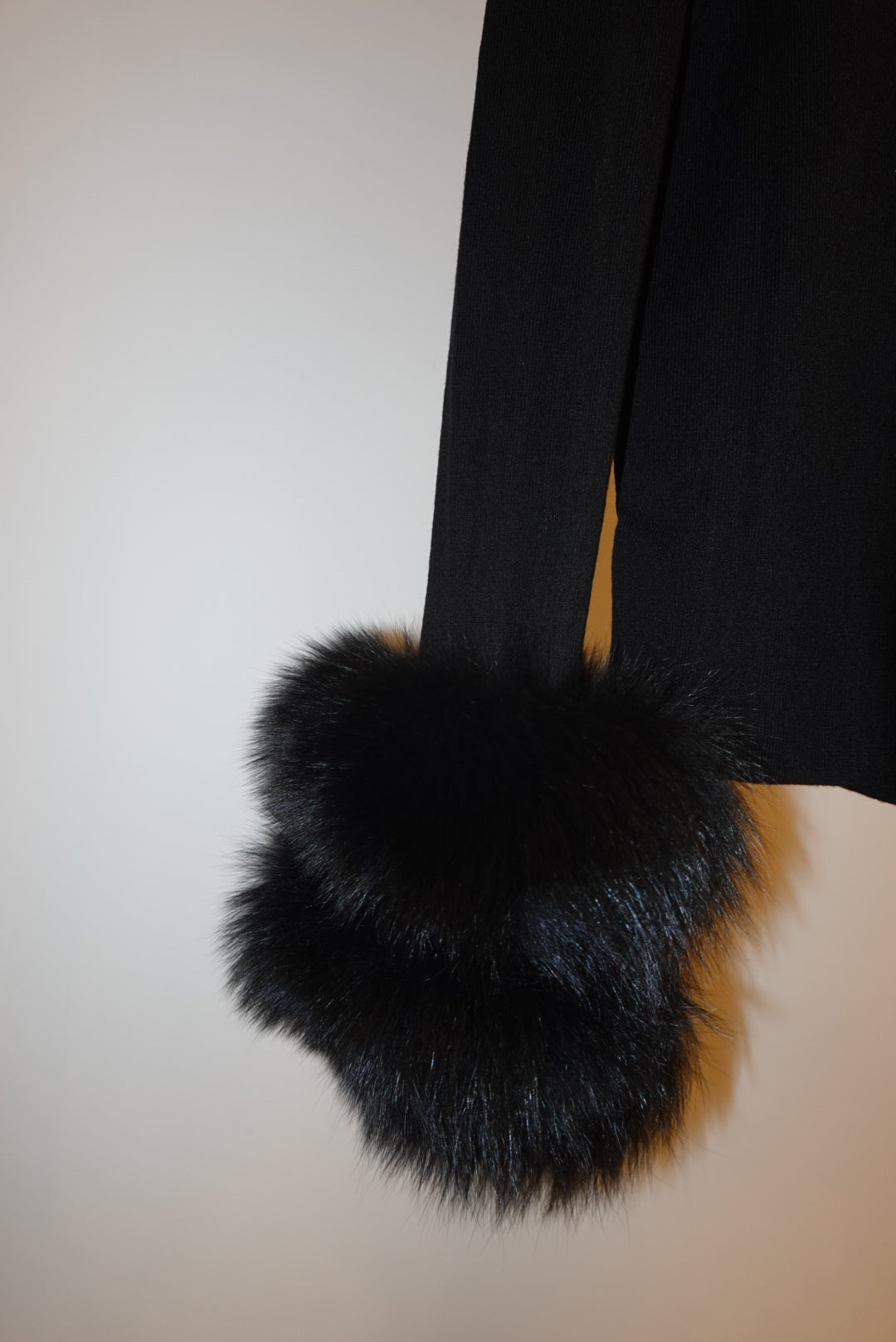 Black top with detachable fur cuffs