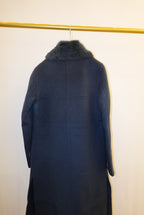 Dark blue fur coat on a white background