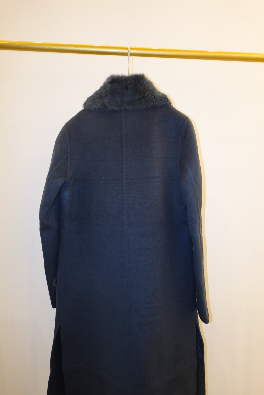 Dark blue fur coat on a white background