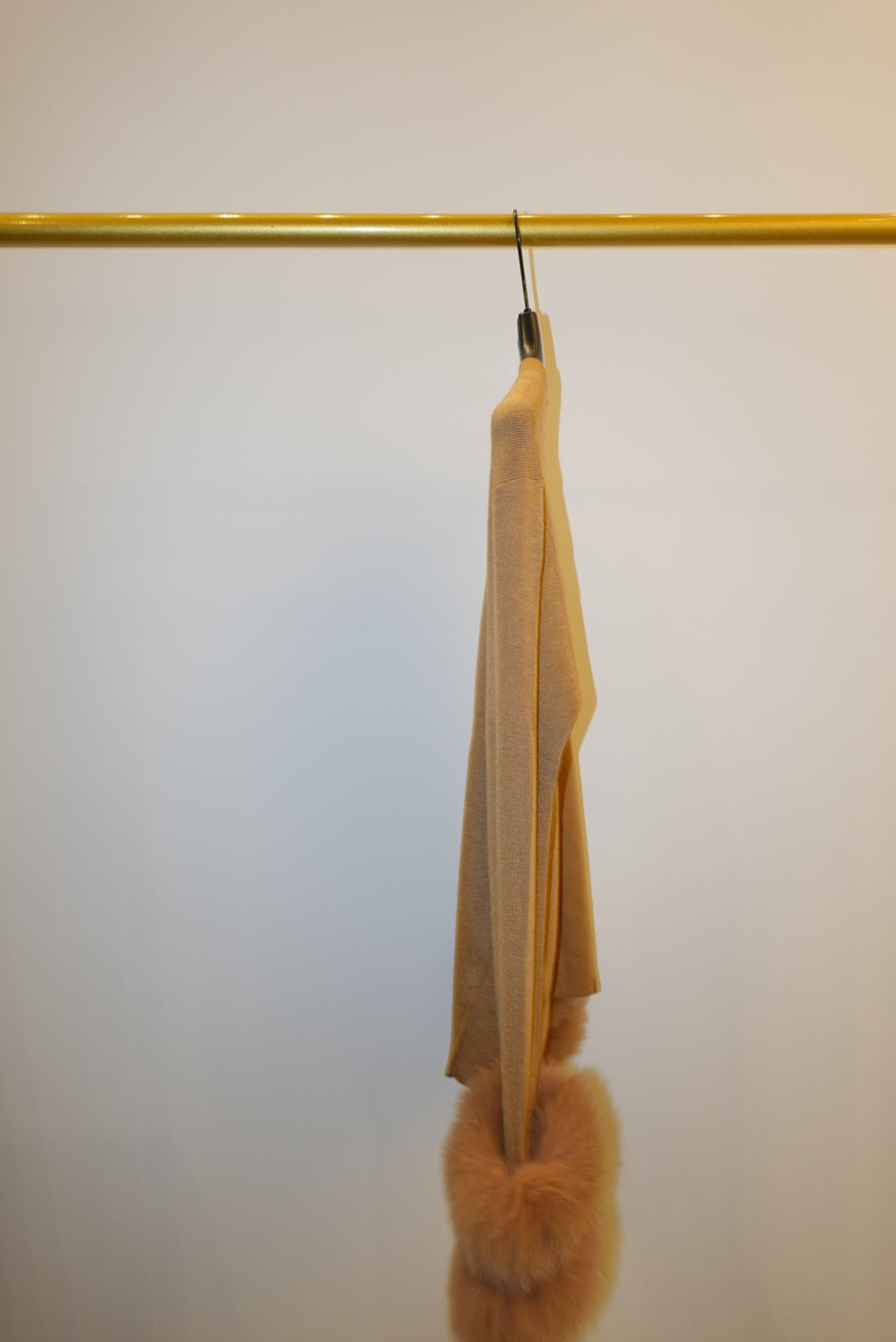 Two tops with detachable fur cuffs