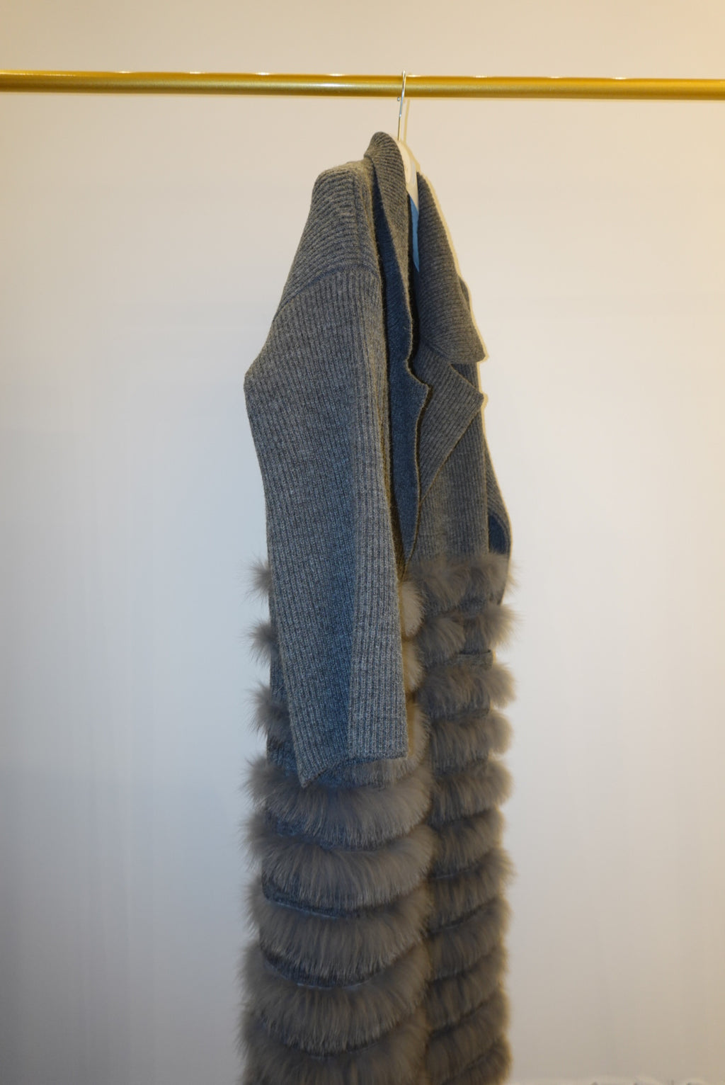 Gray textured coat with fur  on a white background